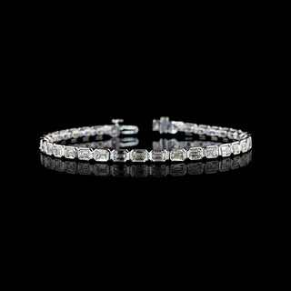 East-West Emerald-cut lab grown diamond tennis bracelet in 14k white gold, bezel setting, 7 carats total.