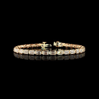 East-West Emerald-cut lab grown diamond tennis bracelet in 14k rose gold, bezel setting, 7 carats total.