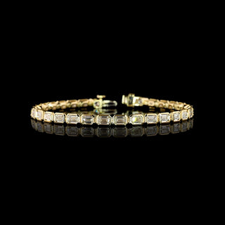 East-West Emerald-cut lab grown diamond tennis bracelet in 14k yellow gold, bezel setting, 7 carats total.