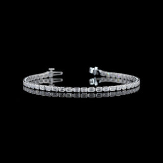 East-West emerald bezel lab-grown diamond tennis bracelet with 3 carats total weight in white gold, 7-inch length.