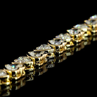 14 carat total weight alternating heart bezel lab-grown diamond tennis bracelet in yellow gold with 25 hearts, 6.5-inch length