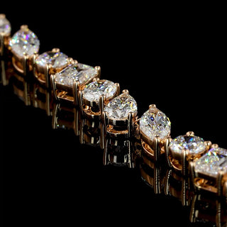 Mixed shape lab-grown diamond tennis bracelet with 7 carats total weight, featuring radiant and round cuts on a 7-inch rose gold band.