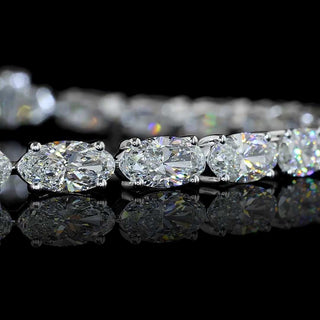 8 carat total weight East-West Moval lab-grown diamond tennis bracelet with 26 round diamonds in white gold, 6.5-inch length.