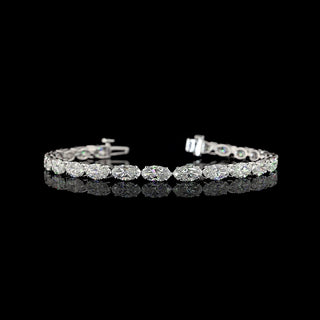 East-west moval lab-grown diamond tennis bracelet with 10 carats total weight, 24 diamonds, set in white gold, 6.5-inch length