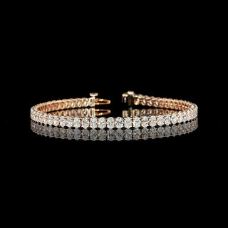 Oval lab-grown diamond tennis bracelet with 7 carats total weight, set in a radiant rose gold design, 7-inch length.