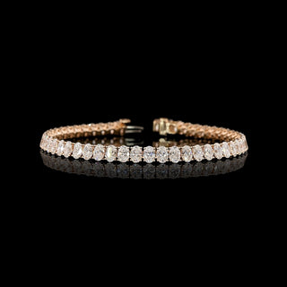 Oval lab-grown diamond tennis bracelet with 10 carats total weight, set in rose gold, featuring sparkling 20-point diamonds.
