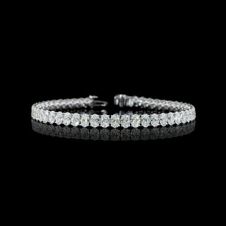 Oval lab-grown diamond tennis bracelet with 10.5 carats total weight in white gold, featuring sparkling 20-point oval diamonds.