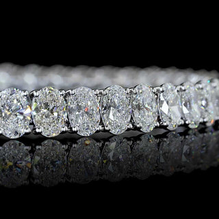 Oval lab-grown diamond tennis bracelet with 10.5 carats total weight in white gold, featuring 20pt oval diamonds.