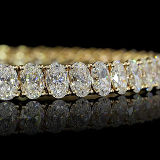 Oval lab-grown diamond tennis bracelet with 10 carats total weight in yellow gold, featuring 20-point diamonds from LabGrownDiamonds.com