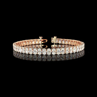 Oval lab-grown diamond tennis bracelet with 11.5 carats total weight, 7-inch rose gold finish, featuring sparkling diamond settings.