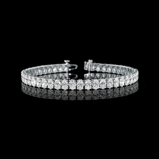Oval lab-grown diamond tennis bracelet with 11.5 carats total weight, white gold setting, 7-inch length, featuring 25pt diamonds.