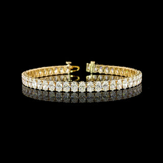 11.5 carat oval lab-grown diamond tennis bracelet with yellow gold setting, 7-inch length, showcasing sparkling diamonds.