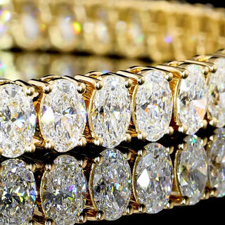 11.5 ct tw oval lab-grown diamond tennis bracelet in yellow gold, 7-inch length, showcasing sparkling gemstone design.