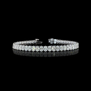 Oval lab grown diamond tennis bracelet in 14k white gold, prong setting, 12 carats total. 