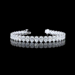 Oval lab-grown diamond tennis bracelet with 20 carats total weight, set in white gold, featuring 35 oval diamonds on a 6.5-inch chain.