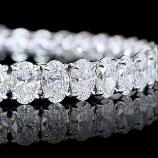 Oval lab-grown diamond tennis bracelet with 20 carats total weight, 35 oval diamonds, white gold setting, 6.5-inch length.