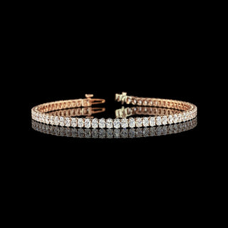Oval lab-grown diamond tennis bracelet with 5 carats total weight featuring 7pt stones on a 7-inch rose gold band.