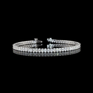 Oval lab-grown diamond tennis bracelet with 5 carats total weight in white gold, 7-inch length, showcasing sparkling oval diamonds.