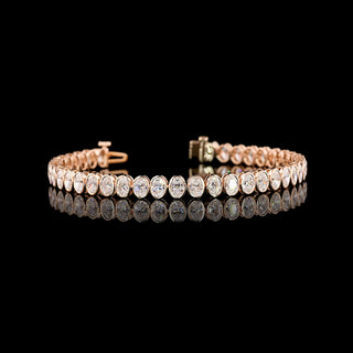 Oval bezel lab-grown diamond tennis bracelet with 8 carats total weight, featuring 18-point diamonds in a vibrant rose gold setting.