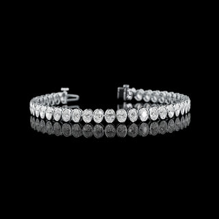 Oval bezel lab-grown diamond tennis bracelet with 8 carats total weight in white gold, featuring 18-point diamonds.