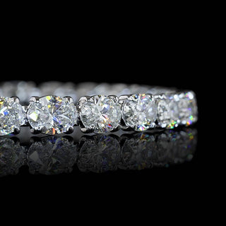 Close-up of East-West Oval lab grown diamond tennis bracelet with 33-pointer diamonds in 14k white gold claw prong setting.