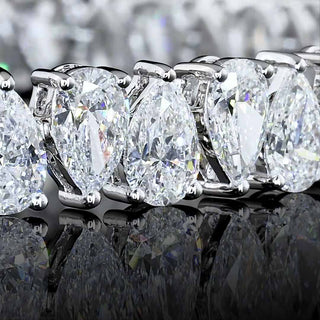 Alternating pear-shaped lab-grown diamond tennis bracelet with 13 carats total weight in white gold, showcasing sparkling diamond settings.