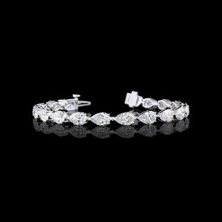 East-West Pear-shaped lab grown diamond tennis bracelet in 14k white gold, prong setting, 14 carats total, with 70-pointer diamonds.