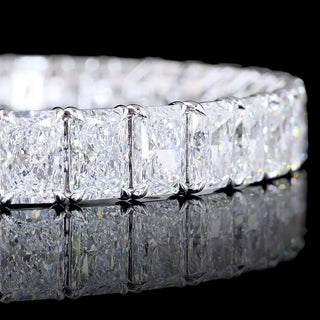 Radiant lab-grown diamond tennis bracelet with 34 carats total weight in white gold, featuring sparkling 100-point diamonds.