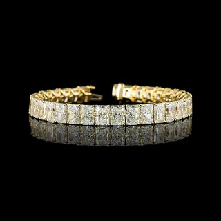 Yellow gold tennis bracelet featuring 34 carats of radiant lab-grown diamonds with a sleek, elegant design.