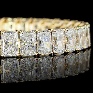 Radiant lab-grown diamond tennis bracelet with 34 carats total weight, yellow gold setting, featuring sparkling 100-point diamonds.