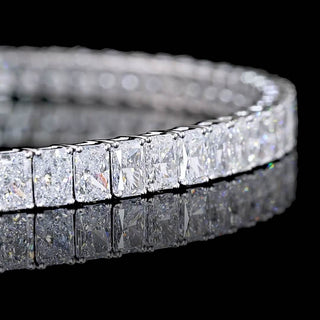 Radiant lab-grown diamond tennis bracelet with 7 carats total weight, 7-inch white gold bracelet, featuring 11-point diamonds.