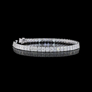 Radiant lab-grown diamond tennis bracelet with 54 white gold links, 12 carats total weight, and 23-point diamonds.