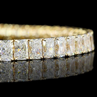 Radiant 15 carat total weight lab-grown diamond tennis bracelet with 43 diamonds on gold chain, 6.25 inches long.