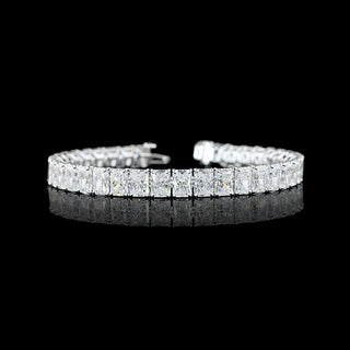 Radiant lab-grown diamond tennis bracelet with 26 carats total weight, 73pt radiant cut diamonds, white gold setting, 7-inch length.