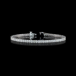 Radiant lab-grown diamond tennis bracelet with 5 carats total weight, 78 round-cut diamonds on a white gold setting, 7-inch length.
