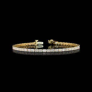 East-West Radiant lab grown diamond tennis bracelet in 14k yellow gold, prong setting, 5 carat total weight.