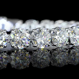 Round lab-grown diamond tennis bracelet with 27 carats total weight, 7-inch white gold setting, 27 diamonds, elegant jewelry piece.