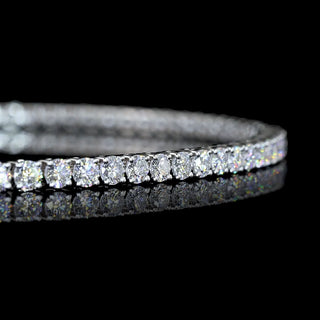Round lab-grown diamond tennis bracelet with 2 carats total weight, 7-inch white gold band, elegant and sparkling jewelry piece.