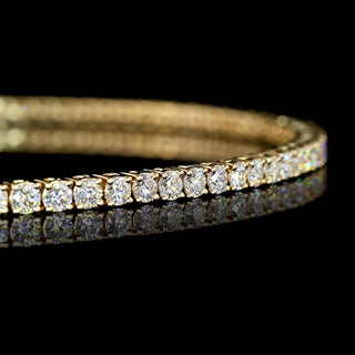 Yellow gold tennis bracelet with round lab-grown diamonds totaling 2 carats, 7-inch length, featuring 2.2pt diamonds from LabGrownDiamonds.com
