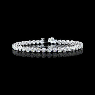 Round lab-grown diamond tennis bracelet with 8-carat total weight and three-prong settings in white gold.