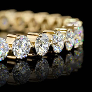 8 carat total weight Lab Grown Diamonds round tennis bracelet with three-prong setting in yellow gold, 7-inch length.