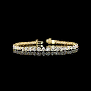 Gold tennis bracelet featuring round lab-grown diamonds totaling 9 carats, 45 stones, 7-inch length, from LabGrownDiamonds.com