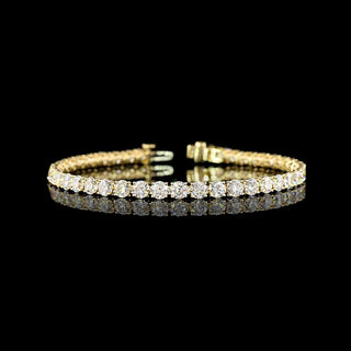 Gold tennis bracelet with 43 round lab-grown diamonds totaling 10.3 carats, 7-inch length, elegant jewelry design.