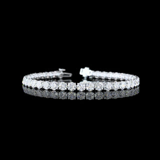 Round lab-grown diamond tennis bracelet with 12.5 carats total weight, 40 sparkling diamonds on a 7-inch white gold band.