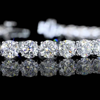 Round lab-grown diamond tennis bracelet with 12.5 carats total weight, 40 diamonds, 7-inch white gold band, elegant jewelry piece.
