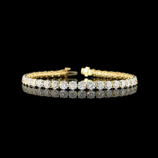 14k yellow gold tennis bracelet with 40 round lab-grown diamonds totaling 12.5 carats, featuring a secure clasp and elegant design.