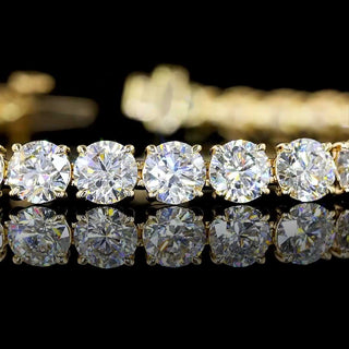 Yellow gold tennis bracelet featuring 40 round lab-grown diamonds totaling 12.5 carats, crafted with 7-inch length.