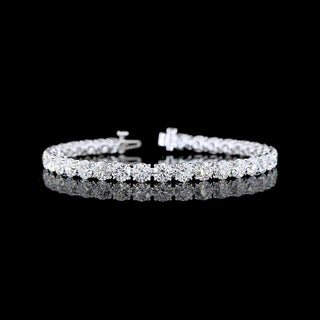 Round lab-grown diamond tennis bracelet with 15 carats total weight, 35 diamonds, white gold setting, 7-inch length.