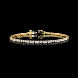 Yellow gold tennis bracelet with round 4-point lab-grown diamond stones totaling 3 carats, 7-inch length, elegant jewelry piece