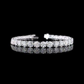 Round lab-grown diamond tennis bracelet with 22 carats total weight, sterling white gold setting, 7-inch length.